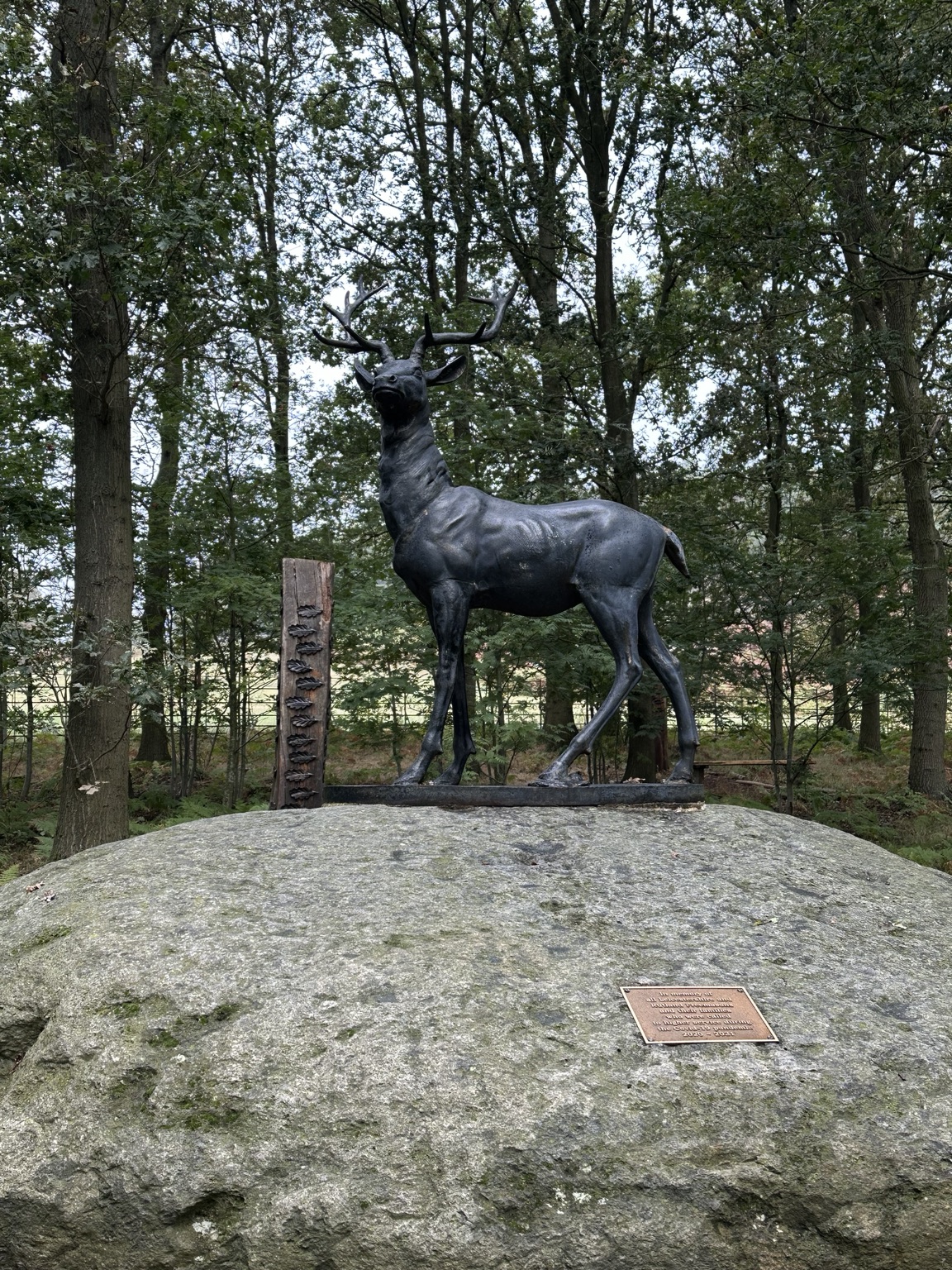 The stag sculpture among trees at Bradgate Park